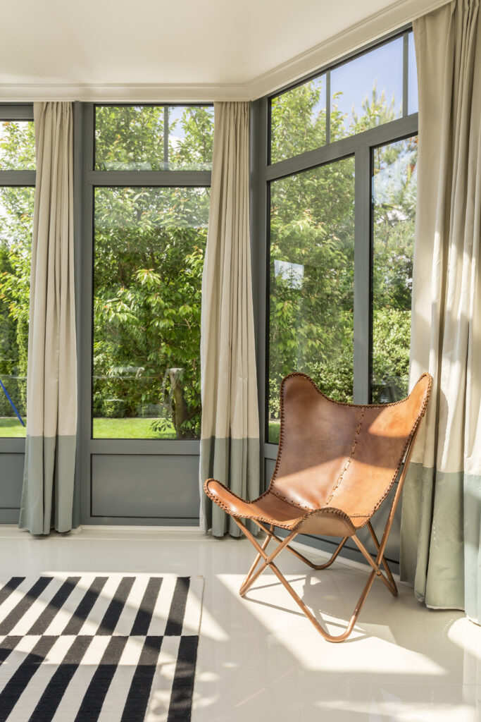 Large windows bring in natural light and make indoor spaces feel open and bright.